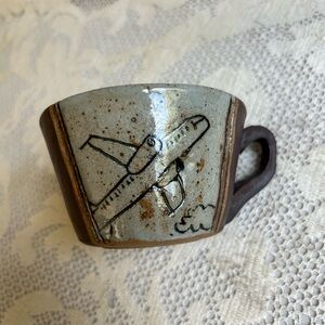 Funny airplane travel pottery mug signed